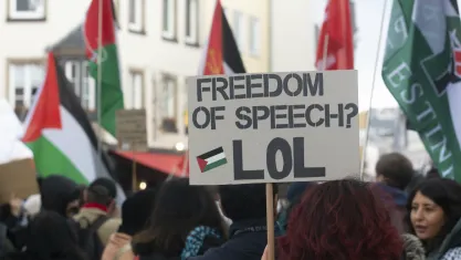 Protester is holding a placard that reads ''Freedom of Speech'' while nearly a hundred people are participating in a demonstration to commemorate Palestinian Prisoners Day in Bonn, Germany copy
