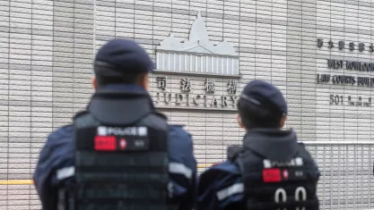 Hong Kong.Police officers stand guard outside a courthouse ahead of a hearing for former media mogul Jimmy Lai in Hong Kong. 