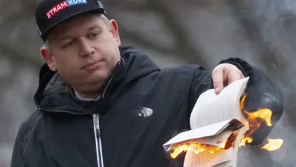 Rasmus Paludan burning a Quran outside the Turkish embassy in Stockholm in January 2023 