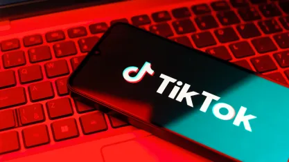 Smartphone on keyboard showing TikTok logo