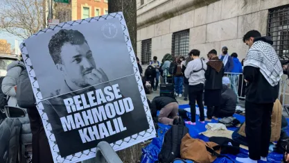 "Release Mahmoud Khalil" sign next to pro-Palestinian protestors outside Columbia University