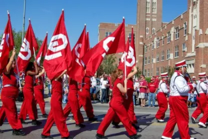 University of Oklahoma Students at Parade holding flags