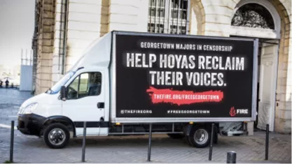 FIRE mobile billboard outside Georgetown University that reads "Help Hoyas Reclaim Their Voices"