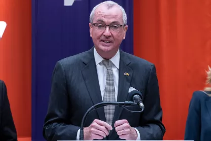 New Jersey Gov Phil Murphy speaking at a podium