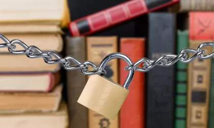 Shelf of books with a locked chain in front of it