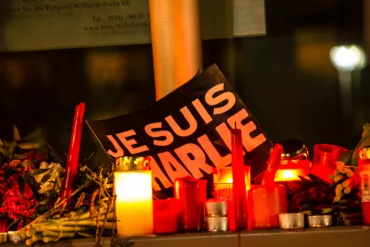 Sign reading Je Suis Charlie at a memorial for the victims of the Charlie Hebdo magazine terror attacks in 2015