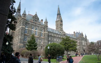 Students walk near Healy Hall at Georgetown University