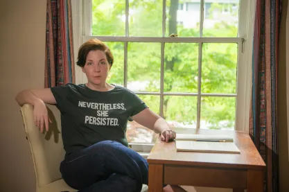 Rebecca Bryant Novak sits at home