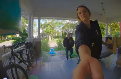 Federal agents approach the door of David Streever