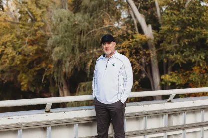 FIRE plaintiff Michael Balow on a bridge overlooking a creek.