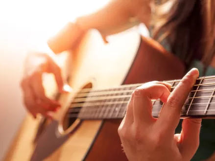 woman playing guitar