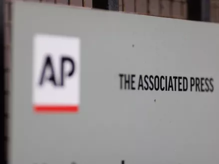 Close-up of a sign with The Associated Press logo