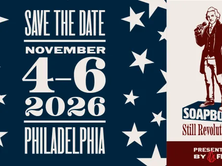 Illustration of a Founding Father standing on a soapbox and holding a microphone next to the words: "Save the Date | November 4-6 2026 | Philadelphia"