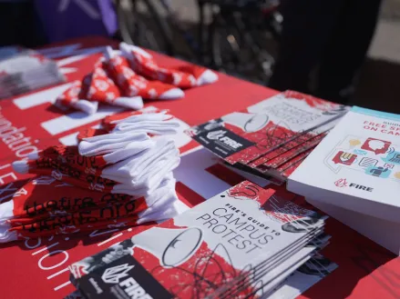 FIRE table at University of Illinois Urbana Champaign 2026 with flyers tshirts and Guide to Free Speech on Campus. Photography by Sylwia Sawicka.