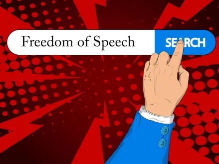 Search bar with text Freedom of Speech and right hand index finger touching search icon.