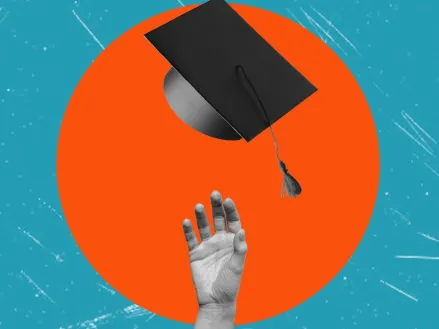 man throws graduation cap