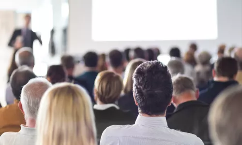 Speaker Giving a Talk at Business Meeting. Audience in the conference hall