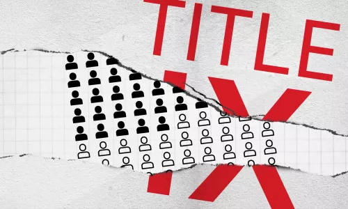 The words "Title IX" on a ripped sheet of paper