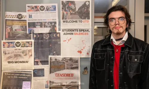 Retrograde editor Gregorio Olivares Gutierrez standing in front of old newspapers