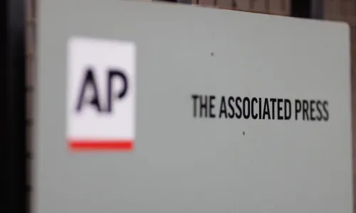 Close-up of a sign with The Associated Press logo