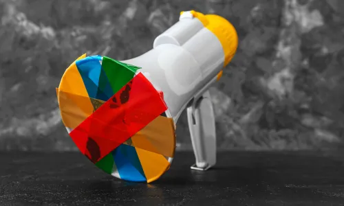 Taped megaphone on dark table