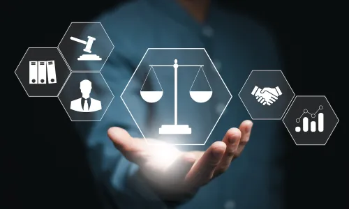 Computer screen showing a gavel scales of justice and books indicating the legal process and procedural fairness