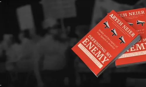 Defending My Enemy books stack