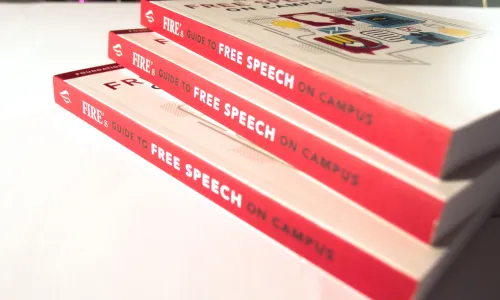 Guide to Free Speech on Campus books stacked with shadows
