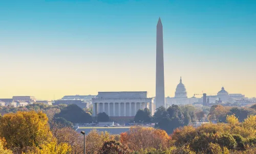 Cityscape panorama of Washington DC skyline with Lincoln Memorial and Washington Monument (Image via Shutterstock)