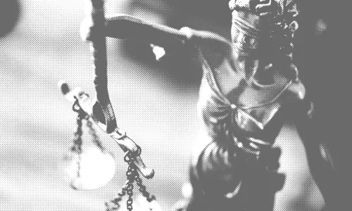 Cover of law faculty survey report showing a statue of justice wearing a blindfold.