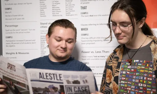 SEIU Alestle editors Dylan Hembrough and Gavin Quinlan reading the student newspaper