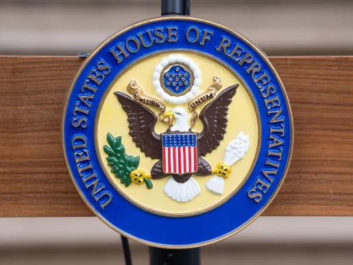 Official seal of the US House of Representatives on a podium