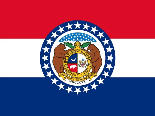 Flag of the state of Missouri: A horizontal tricolor of red, white, and blue, with the arms from the Great Seal of Missouri centered on the three bands. The Seal is bordered by a wide band of blue with 24 white stars