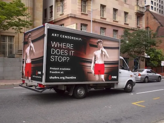 FIRE mobile billboard at Hamline University with the words "Art Censorship: Where does it stop?" alongside an image of Michelangelo's sculpture of "David" but with the male nudity covered up with red boxer briefs.