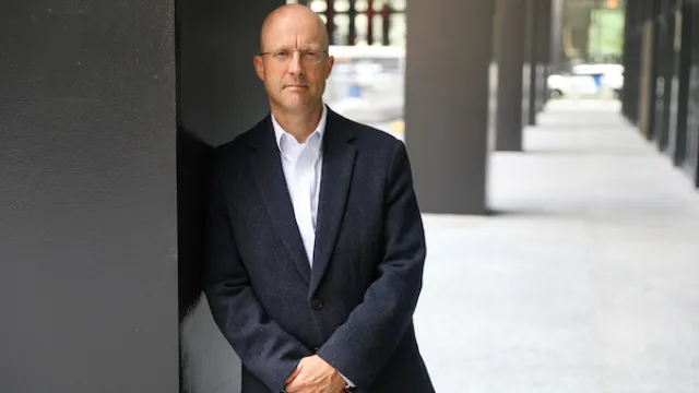 University of Illinois Chicago law professor Jason Kilborn leaning against a pillar.