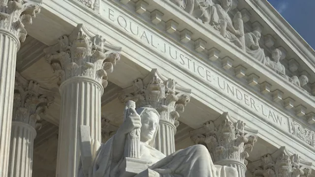 Equal Justice Under Law engraving above entrance to US Supreme Court Building.