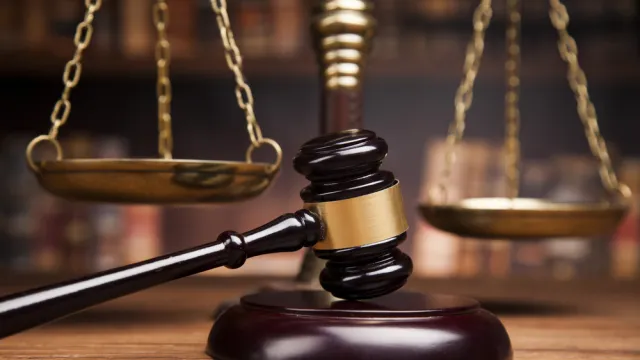 Gavel and scales of justice in a courtroom