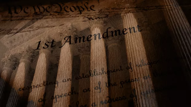 First Amendment text of the United States Constitution over the Supreme Court building