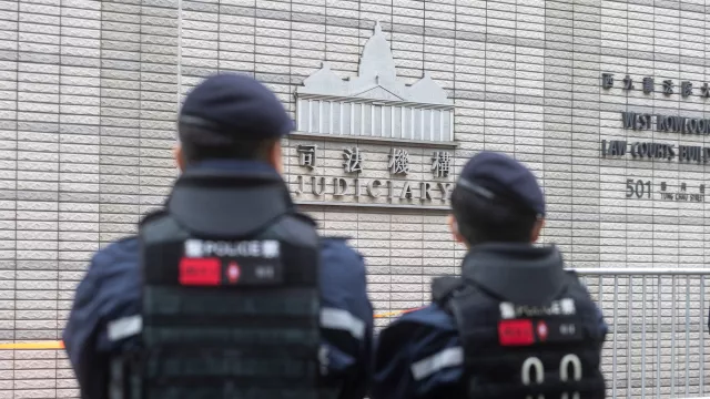 Hong Kong.Police officers stand guard outside a courthouse ahead of a hearing for former media mogul Jimmy Lai in Hong Kong. 