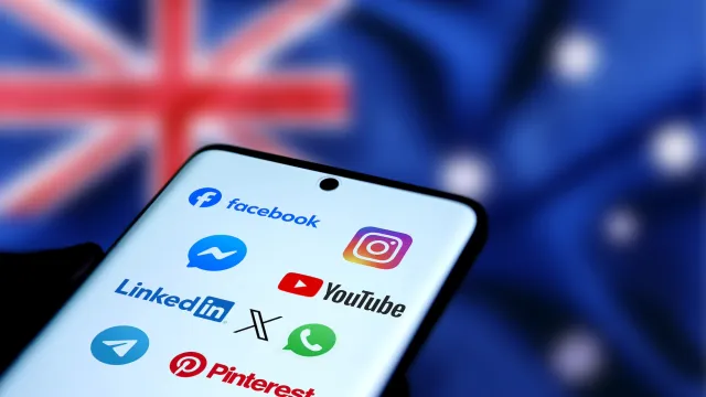 Smart phone showing social media icons with the flag of Australia in the background