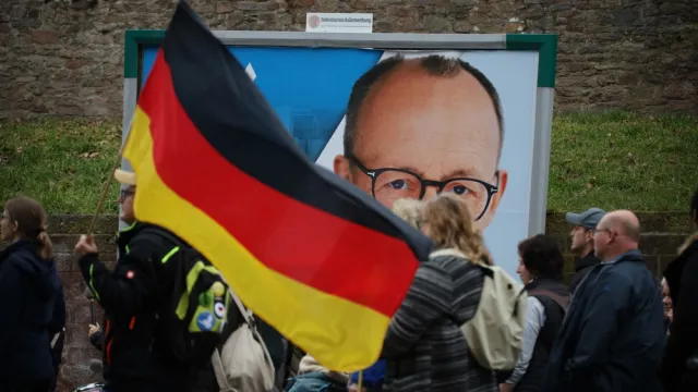 People wave German flag in support of AfD