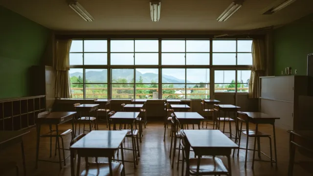 empty classroom with a large window in the background